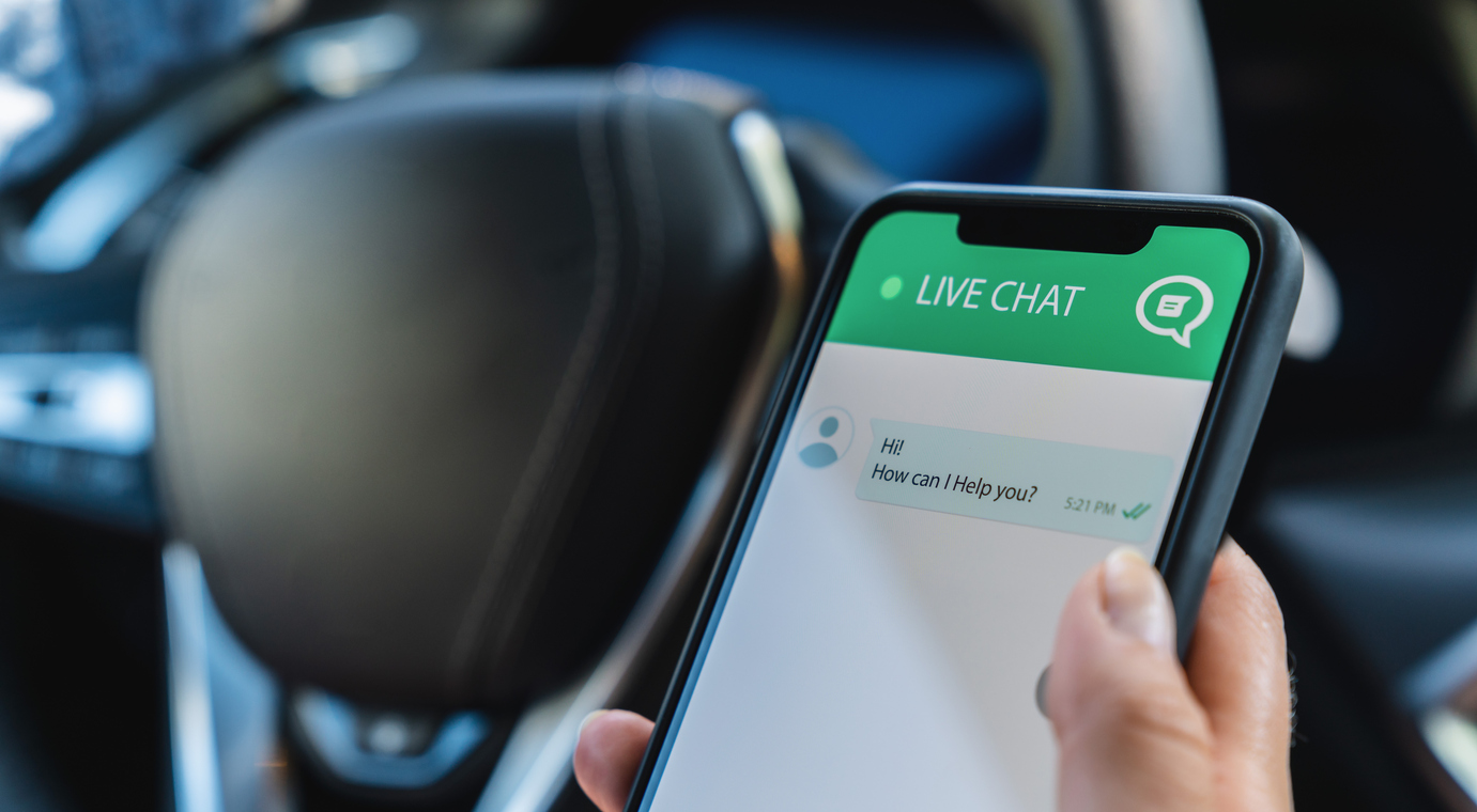 Customer experience staff uses customer service and support live chat with chatbot and automatic messages or human servant in the car. Assistance and help with mobile phone app. Smartphone helpdesk for feedback cell.